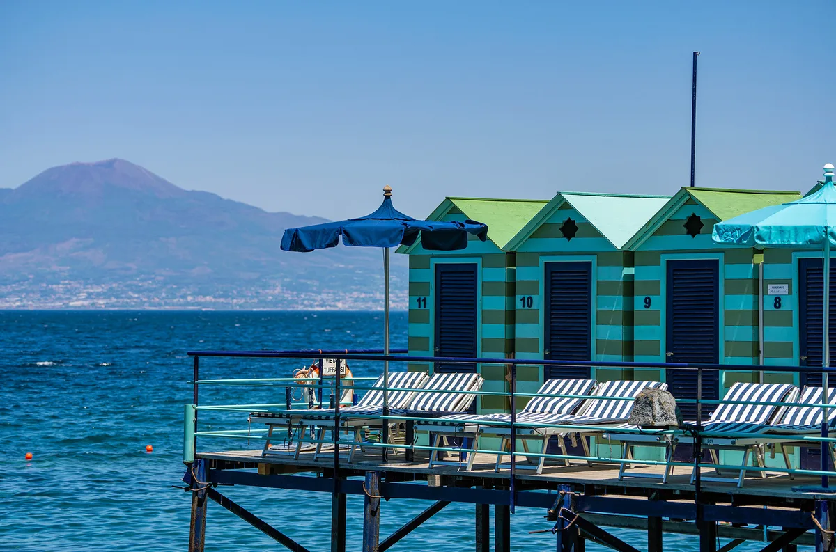 Oversized sunbeds and a Jacuzzi on the wooden platforms at Marameo Beach, Marina Piccola