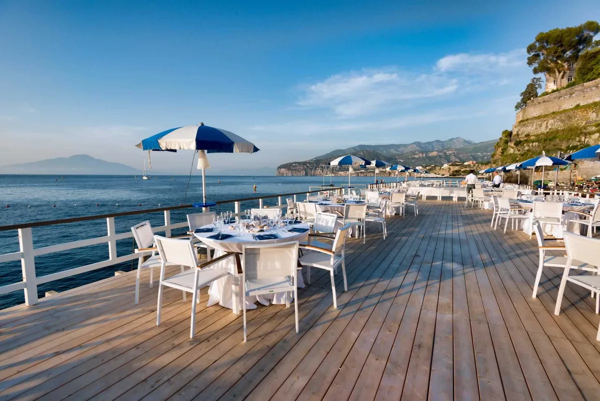 Pier tables stretching over the water at Bagni Sant'Anna, Marina Grande