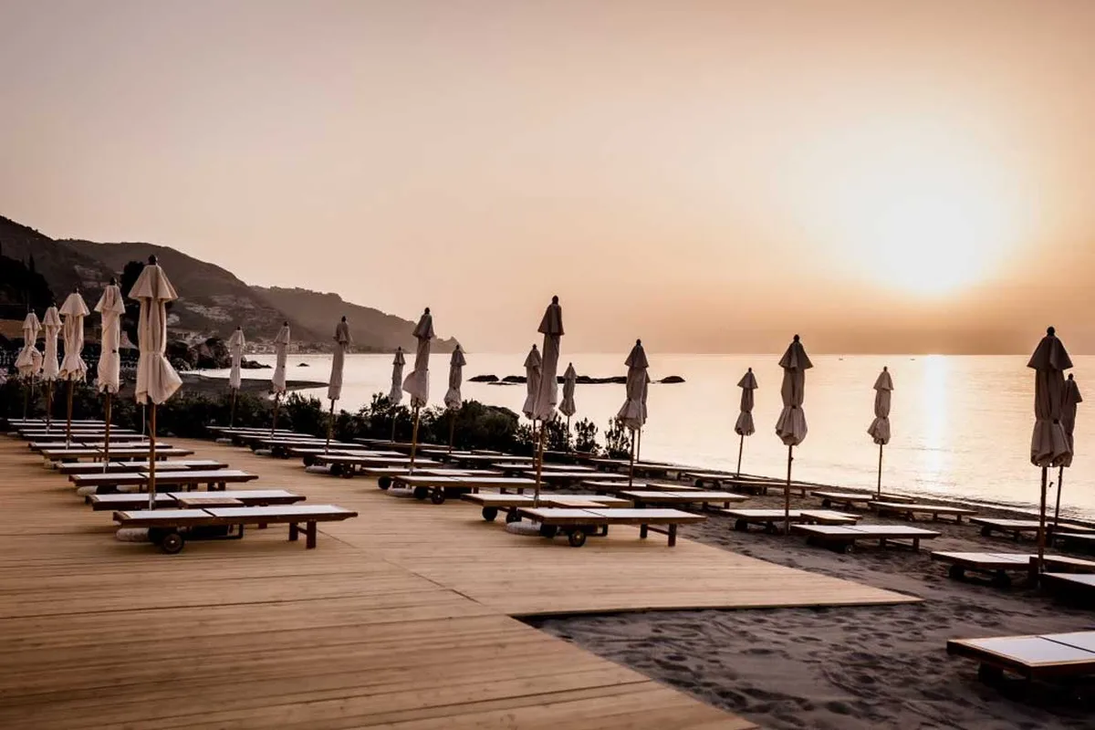 Well-spaced beds and cabanas at Tao Beach Club, Spisone