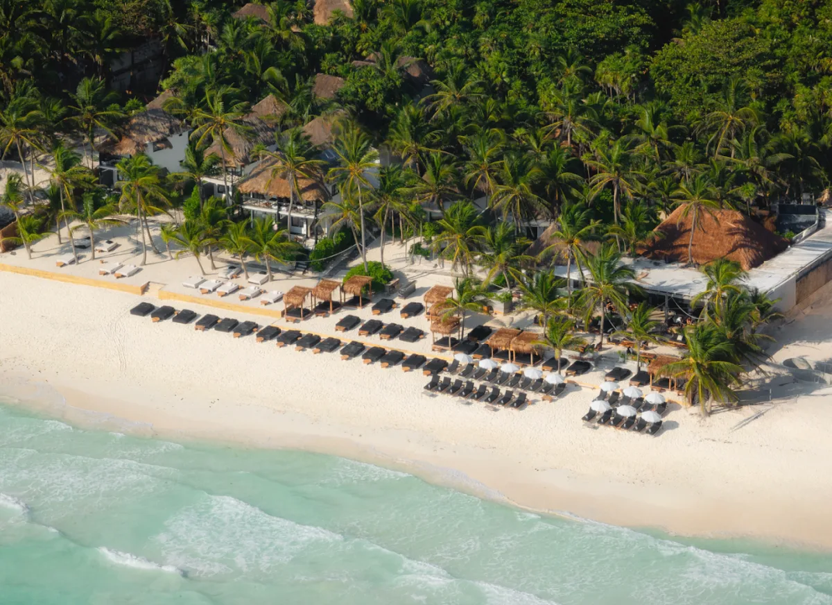Pink neon and white sand at Gitano Beach, south Tulum